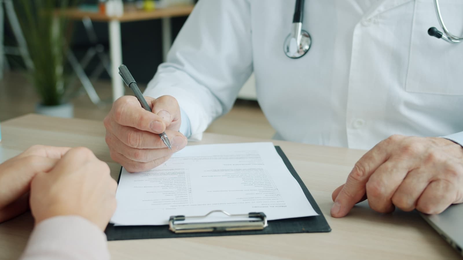 Clinician reviewing a results summary with a patient
