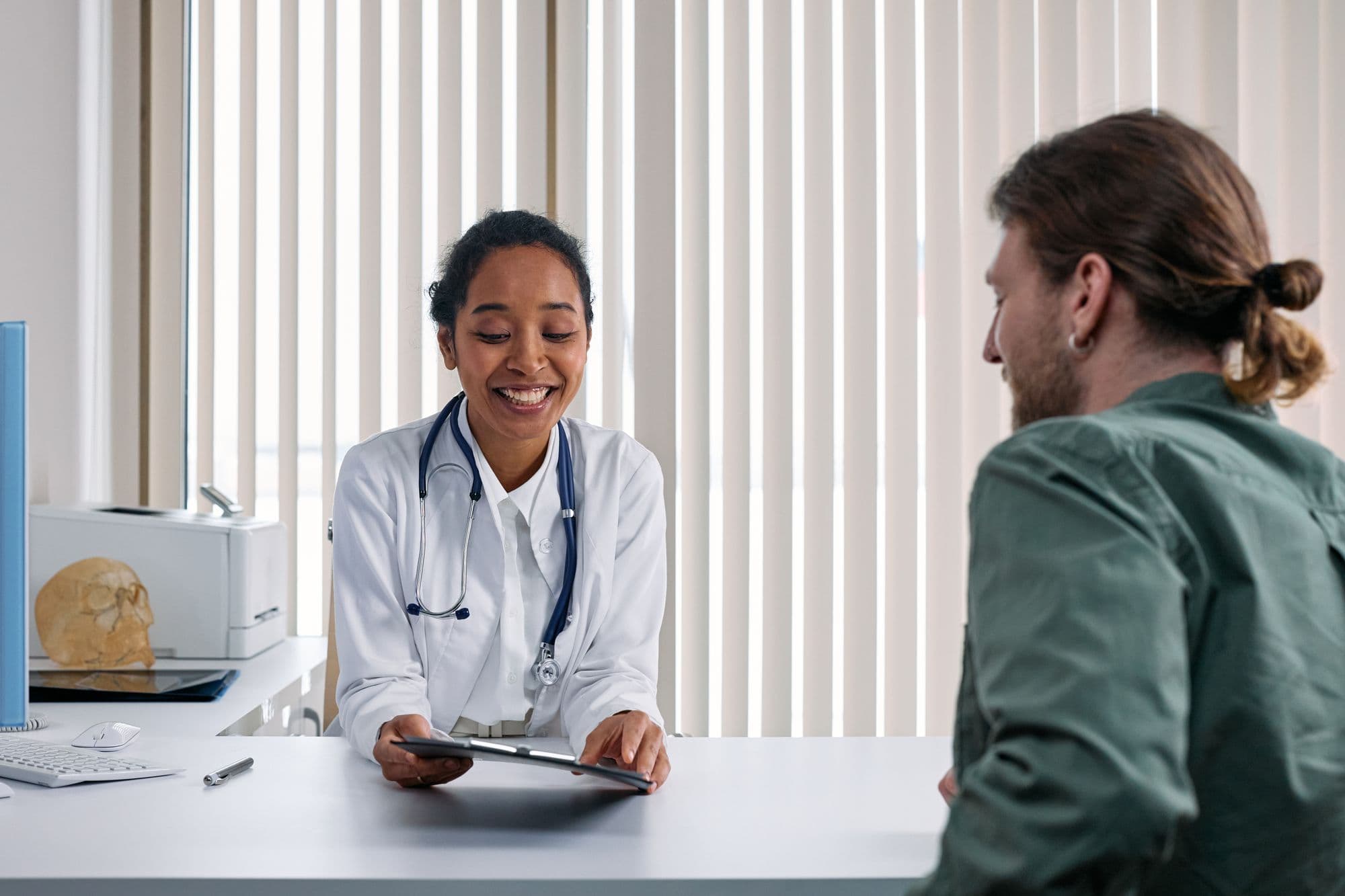 Clinician reviewing results with a patient in a consultation room